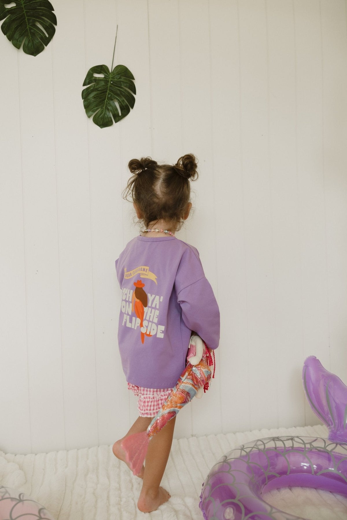 Mermaid graphic long sleeve tee model wearing shirt
